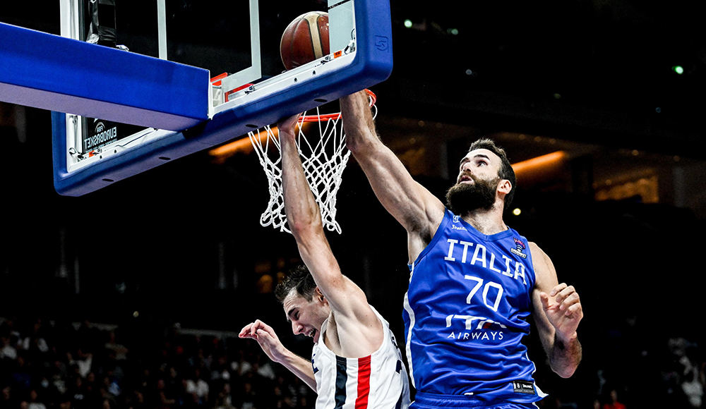 epa10184194 Luigi Datome (R) of Italy in action against Terry Tarpey of France during the FIBA EuroBasket 2022 Quarter Finals match between Italy and France at EuroBasket Arena in Berlin, Germany, 14 September 2022.  EPA/FILIP SINGER